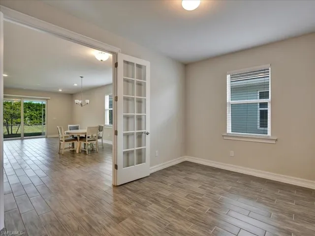 Spare room with wood tiled floors