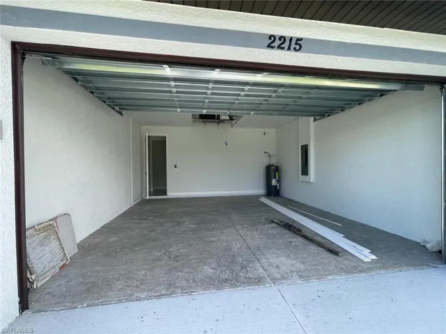 Garage with electric panel and water heater