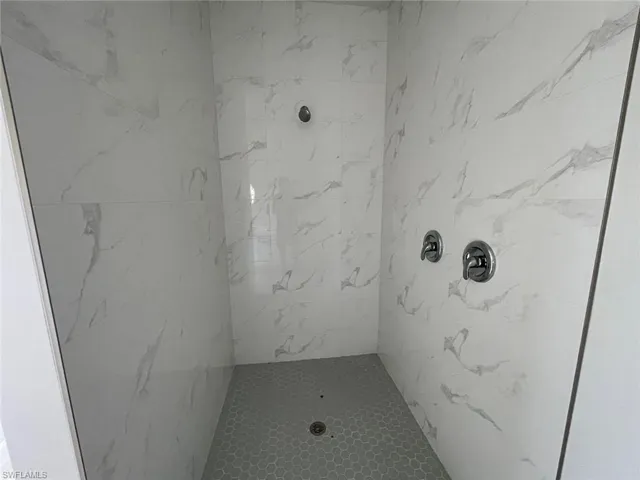 Bathroom with tiled shower