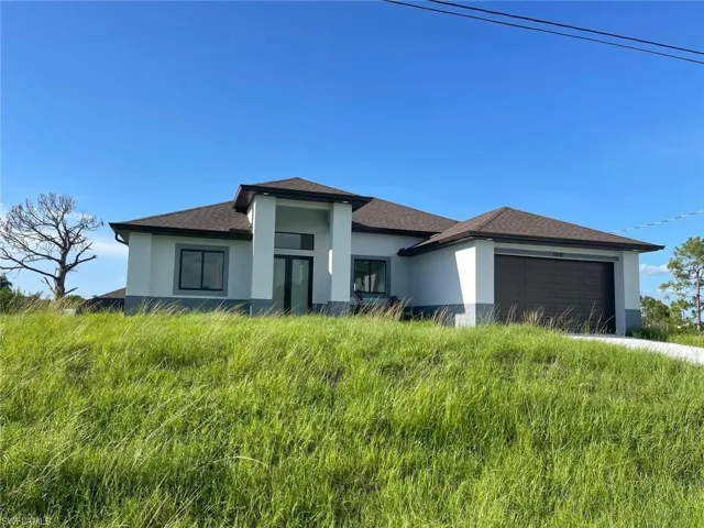View of front of home featuring a garage