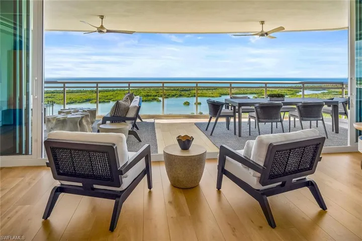 Enjoy effortless indoor–outdoor living, with the furnished great room opening to a generous glass-railed terrace that expands the living area.