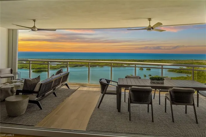 Sweeping sunset views of the Intracoastal and the Gulf of Mexico from the spacious 32-foot terrace, where boats glide by and dolphins often play