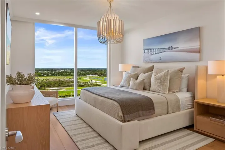 The north wing leads to a furnished king-size guest bedroom with impact windows showcasing spectacular Kinsale Golf Club views