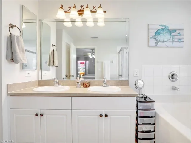 Bathroom with a bathtub, and dual sink vanity