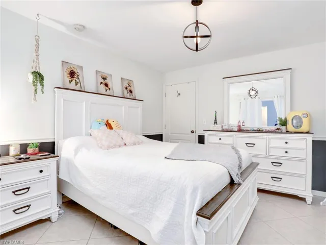 Bedroom featuring light tile floors