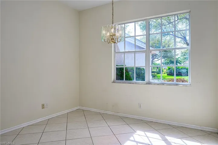 Formal Dining room with light tile patterned floors - Ready for a you to put your finishing touches on!