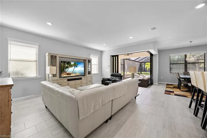 Living room featuring recessed lighting and a chandelier
