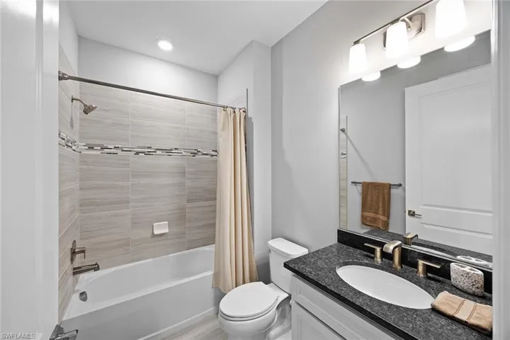 Full bathroom featuring vanity and shower / bath combo
