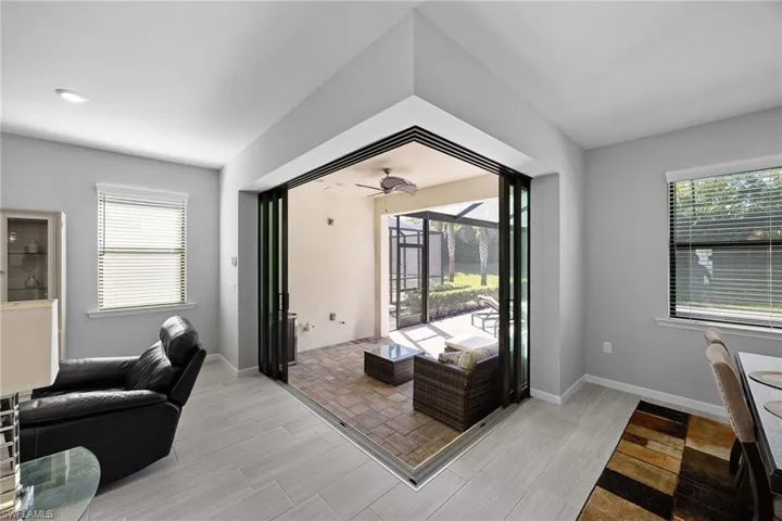 Living area featuring plenty of natural light and a sunroom