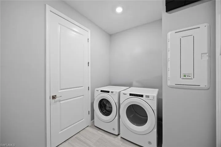 Laundry room with washing machine and clothes dryer
