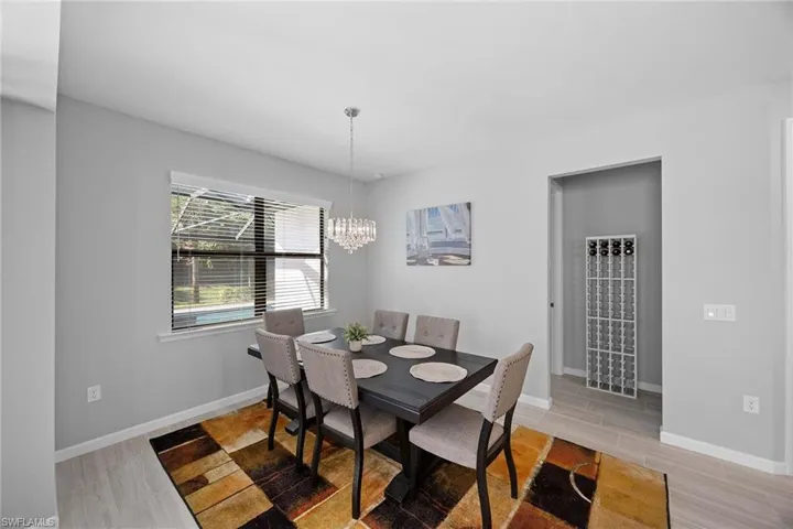 Dining room with a chandelier and wood finish floors