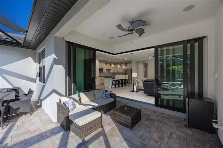View of patio / terrace featuring ceiling fan, outdoor dining area, and an outdoor hangout area