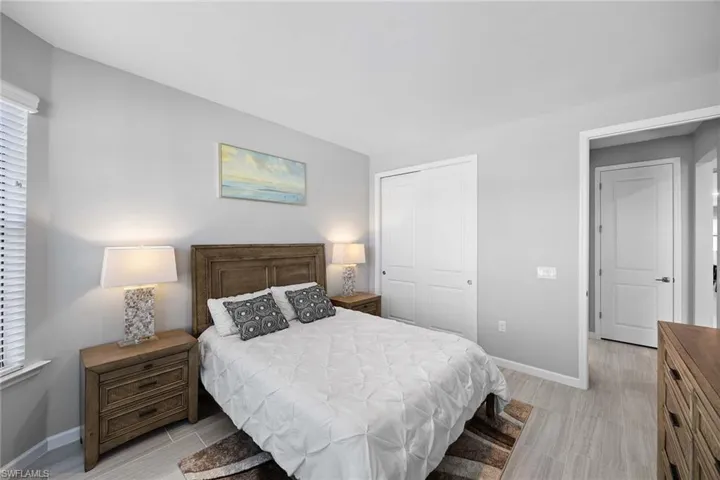 Bedroom with a closet and wood tiled floors