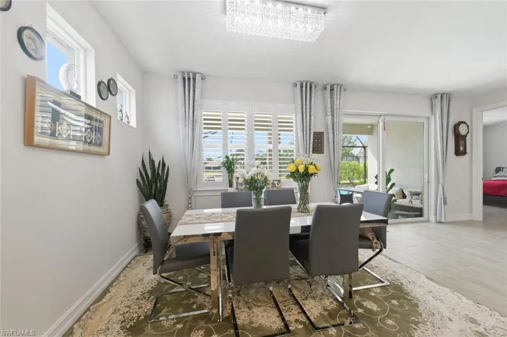 Dining space with light wood-type flooring and baseboards
