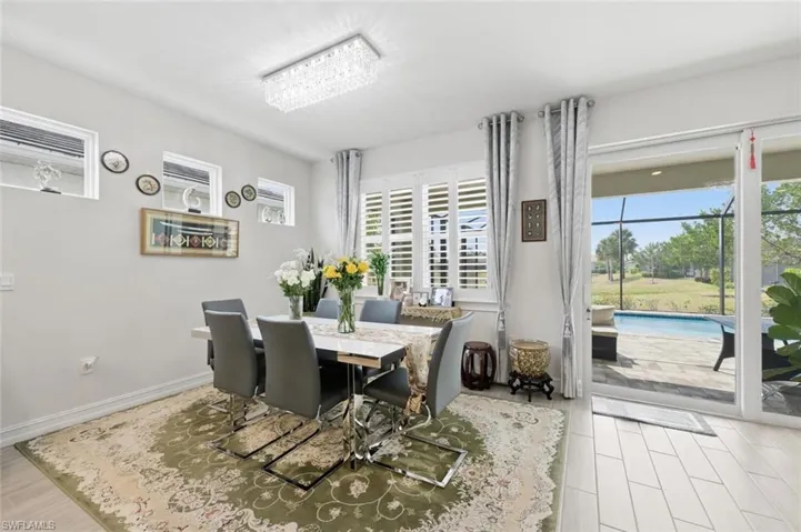 Dining area featuring light wood finished floors and baseboards