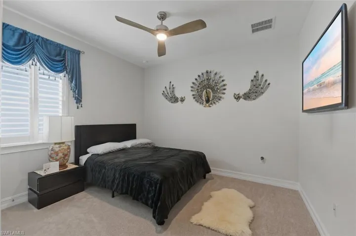 Bedroom with carpet floors and ceiling fan