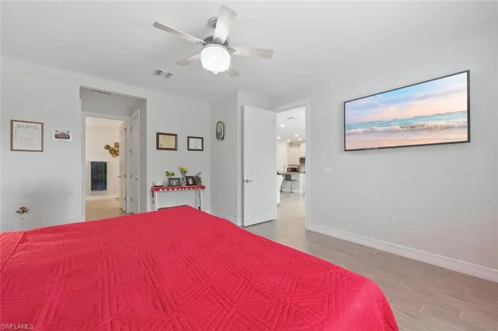Bedroom featuring a ceiling fan and light wood-style flooring