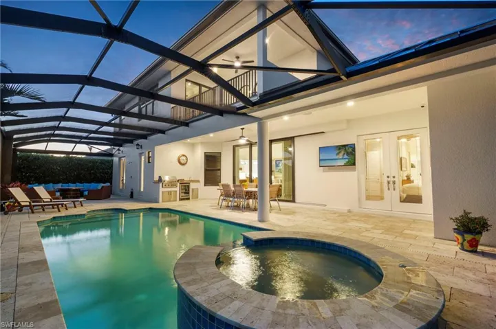 View of swimming pool featuring french doors, an outdoor hangout area, area for grilling, and a patio area