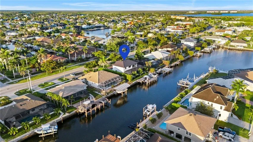 Aerial view of residential area featuring a large body of water