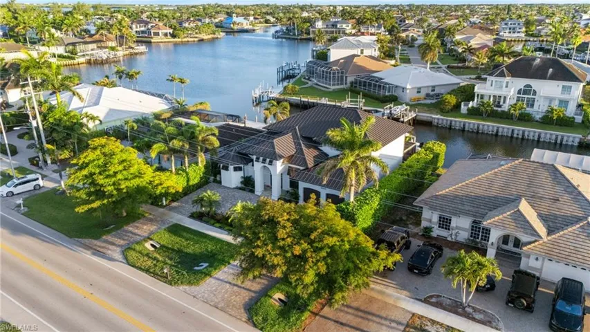 Aerial perspective of suburban area with a nearby body of water