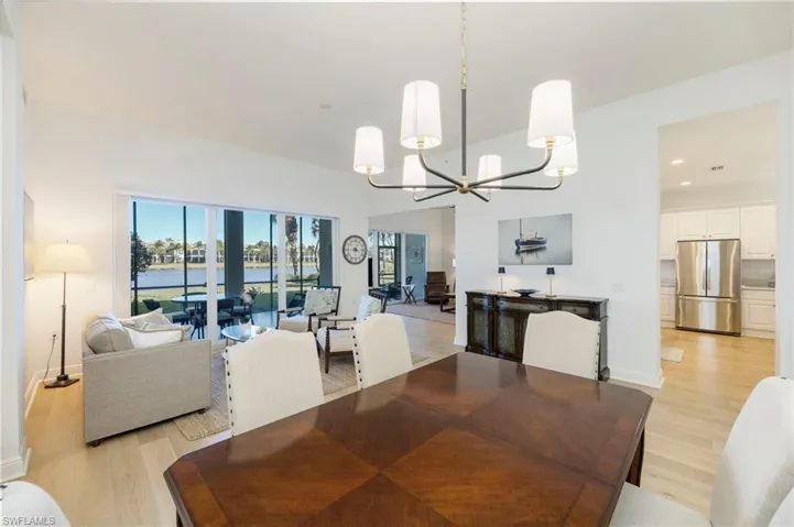 Dining space featuring a chandelier, light wood finished floors, and recessed lighting