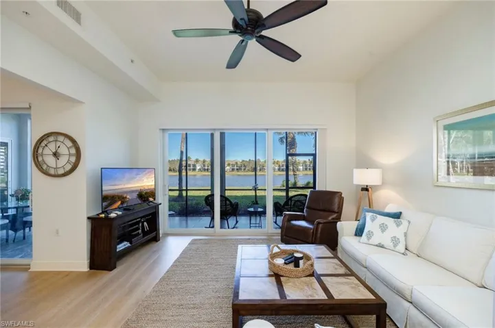 Living area featuring a ceiling fan and light wood finished floors
