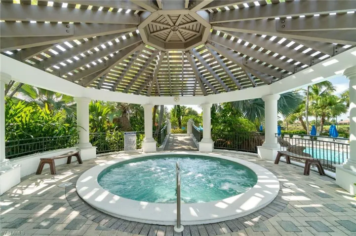 View of swimming pool featuring a hot tub, a patio, a pergola, and a swimming pool
