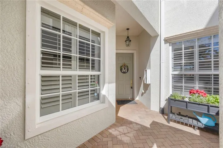 Entrance to property featuring stucco siding