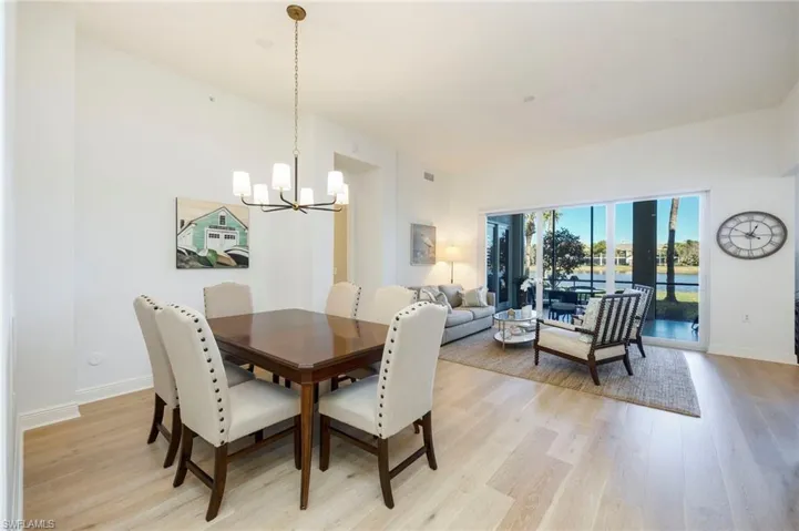 Dining space featuring light wood-style flooring and a chandelier