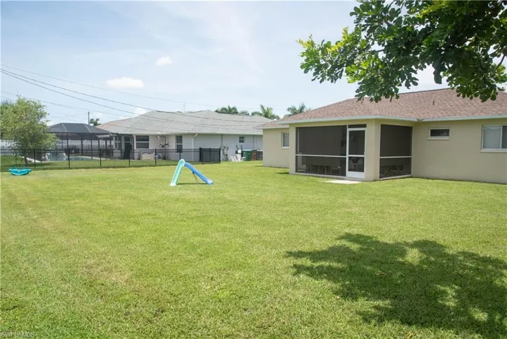 View of yard featuring a sunroom
