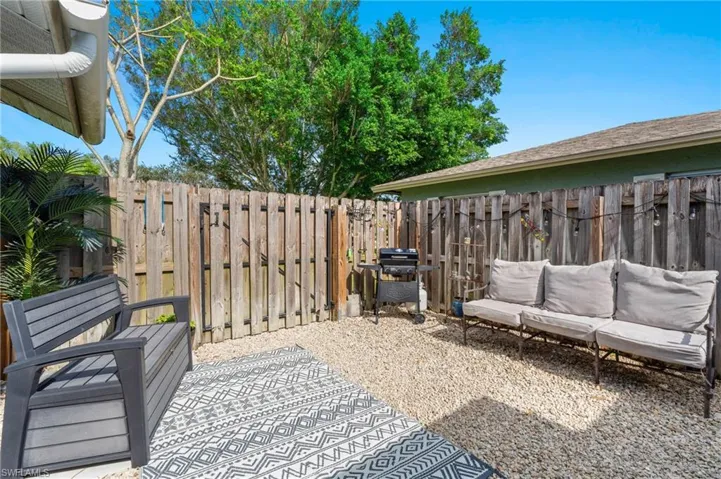 View of patio with an outdoor living space and grilling area