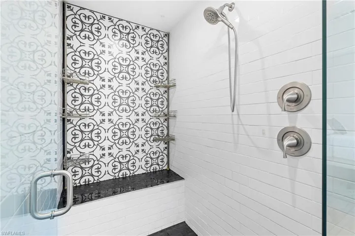 Bathroom with a shower with shower door