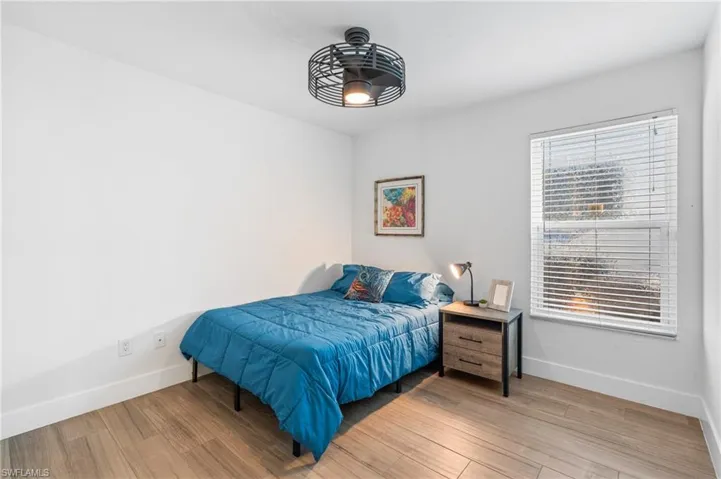 Bedroom featuring wood-type flooring