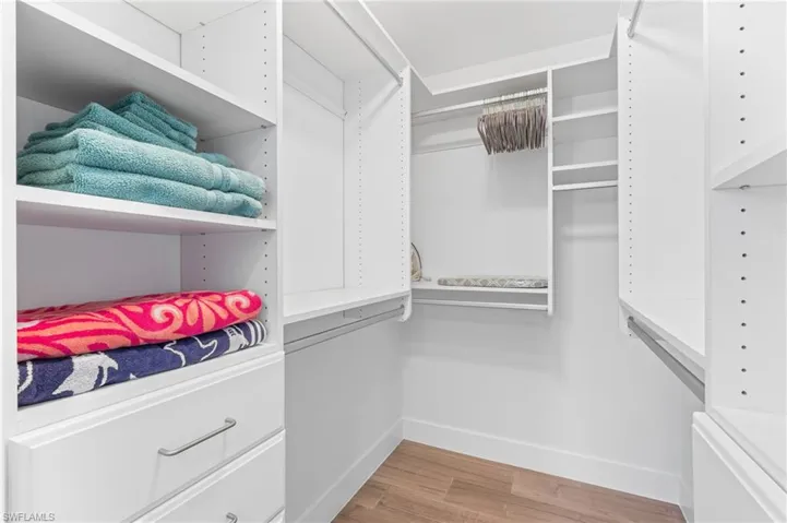 Walk in closet featuring light hardwood / wood-style floors