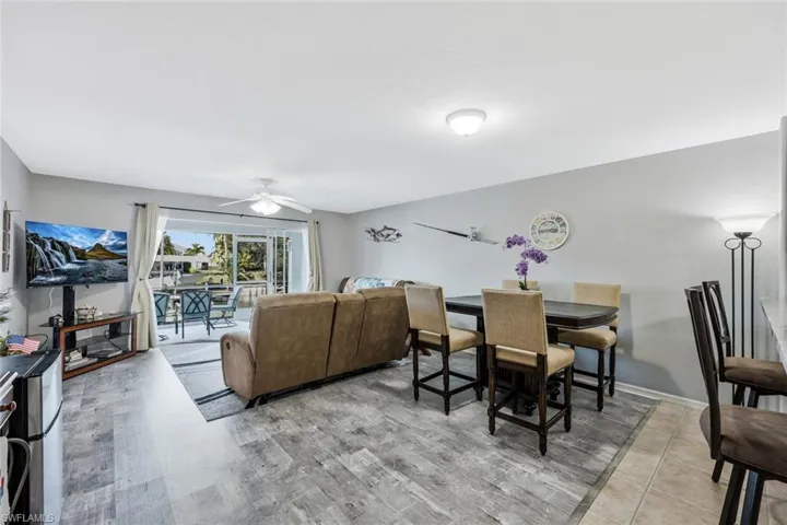 Dining area with ceiling fan and baseboards