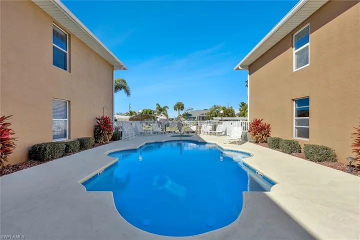 Community pool featuring a patio area