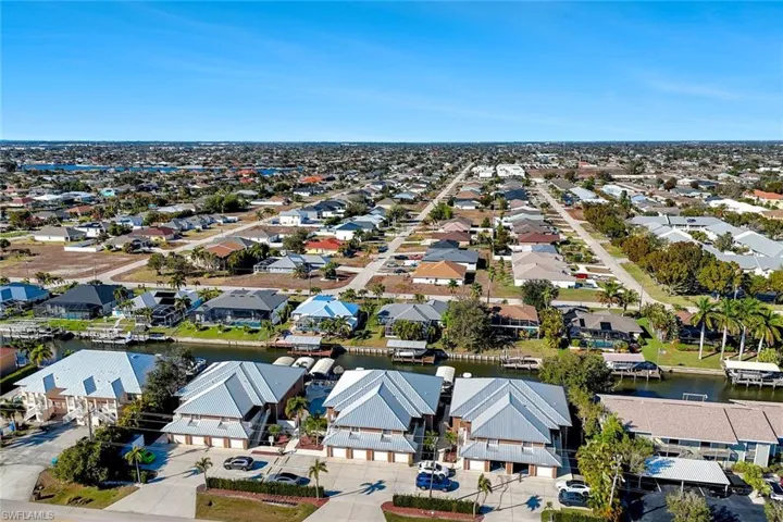 Aerial view of residential area with a nearby body of water