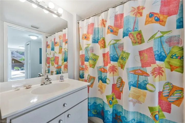 Full bathroom featuring vanity and a shower with shower curtain