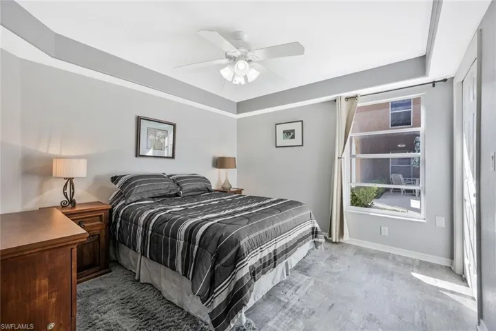 Bedroom with ceiling fan and baseboards