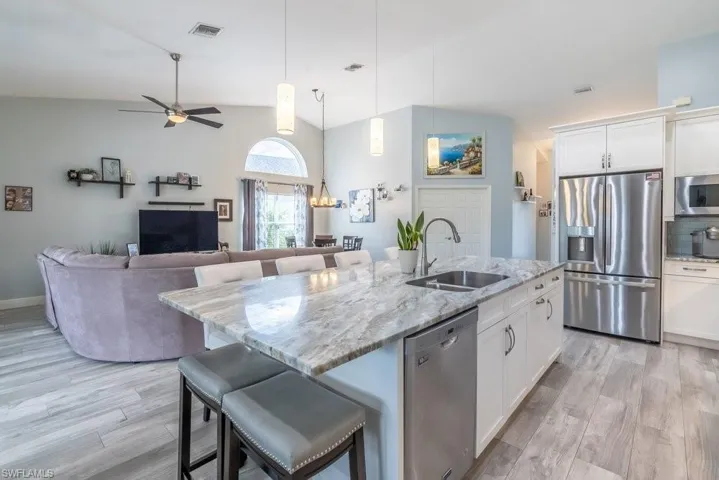 Kitchen with granite countertops, stainless appliances