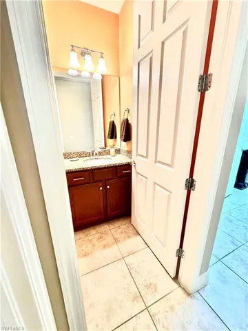 Bathroom featuring vanity and light tile patterned flooring