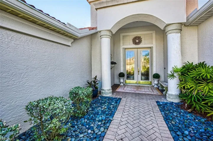 Doorway to property featuring french doors