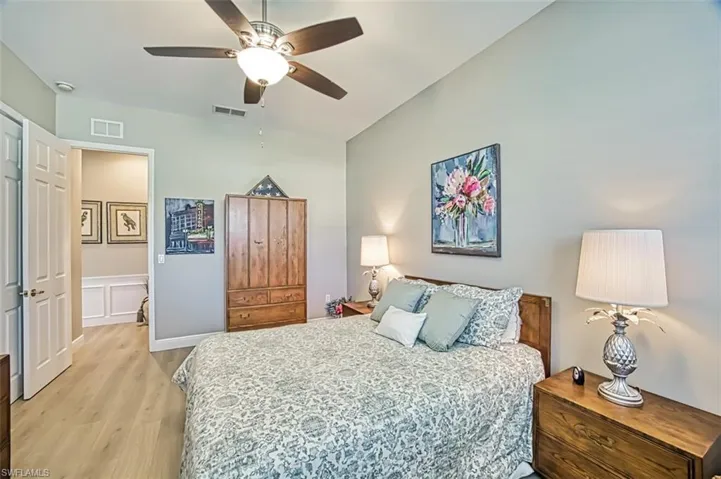 Bedroom featuring light hardwood / wood-style floors and ceiling fan