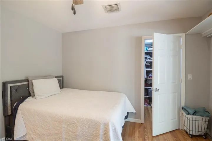 Bedroom featuring light wood-type flooring and a ceiling fan