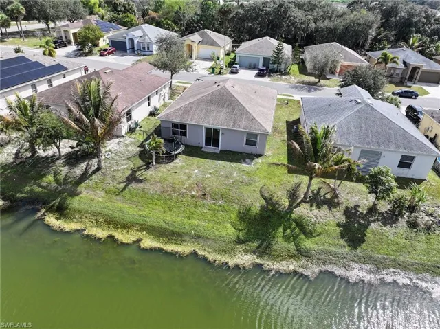Aerial view of residential area with a large body of water