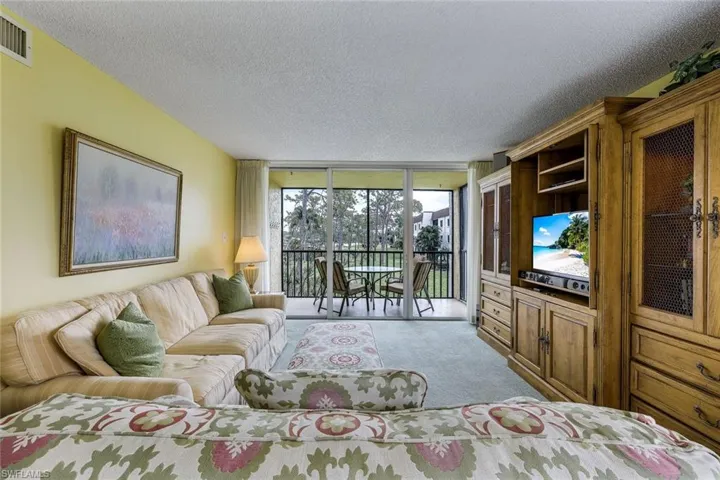 Enjoy views of the pool and lush landscaping from your living room.