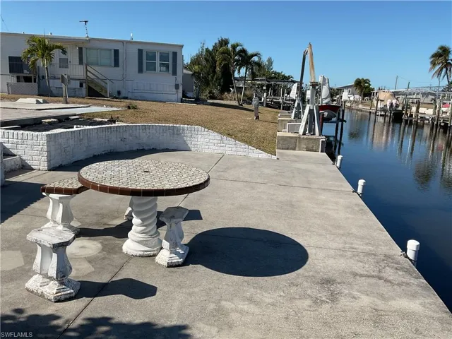 Dock with a water view and boat lift