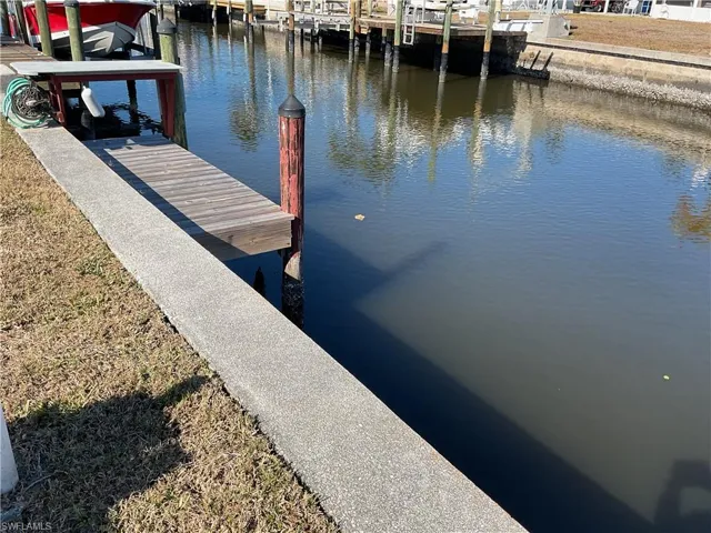 Dock area with a water view and a fish cleaning station