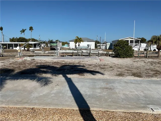 View of yard featuring a residential view and a boat dock