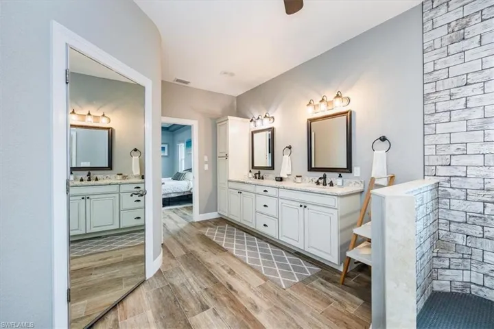 Walk in closet with custom shelving and storage